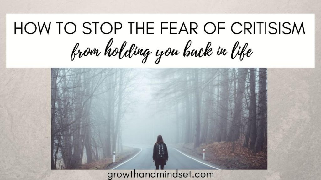 How to Stop the fear of criticism from holding you back in life - person walking down the middle of the road between wooded areas.